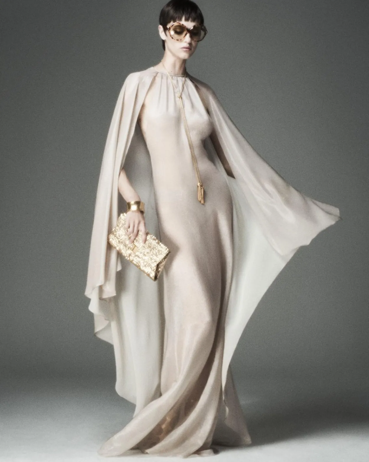 EVENING DRESS WITH KEYHOLE NECKLINE AND ASYMMETRIC CAPE